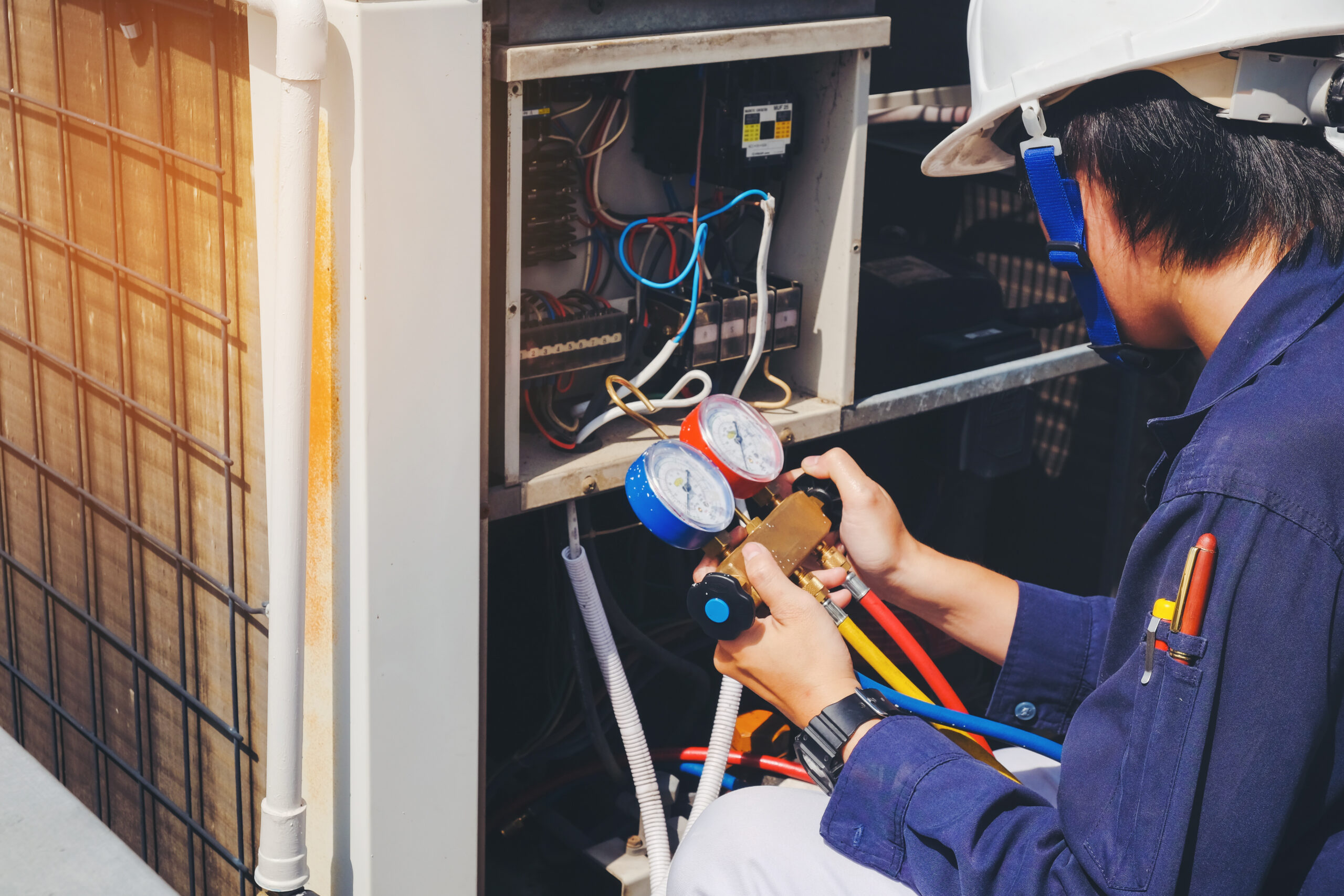 technician is checking air conditioner